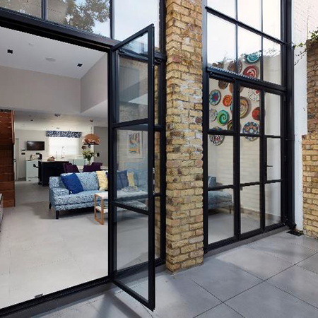 Steel and glass frames extend beautiful rear extension